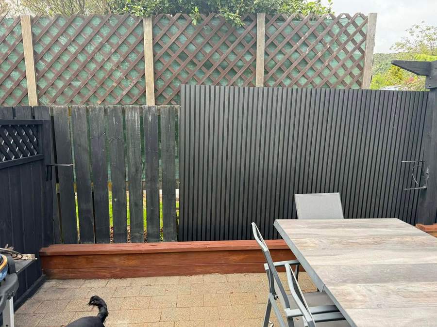 Composite fencing next to an old paling fence for comparison