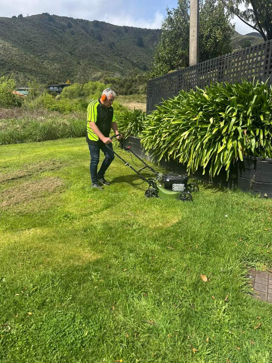 Marlborough Lawns & Property Services mowing a section with the Marlborough hills behind