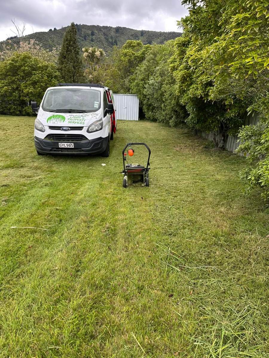 Marlborough Lawns & Property Services van beside a freshly mowed lawn