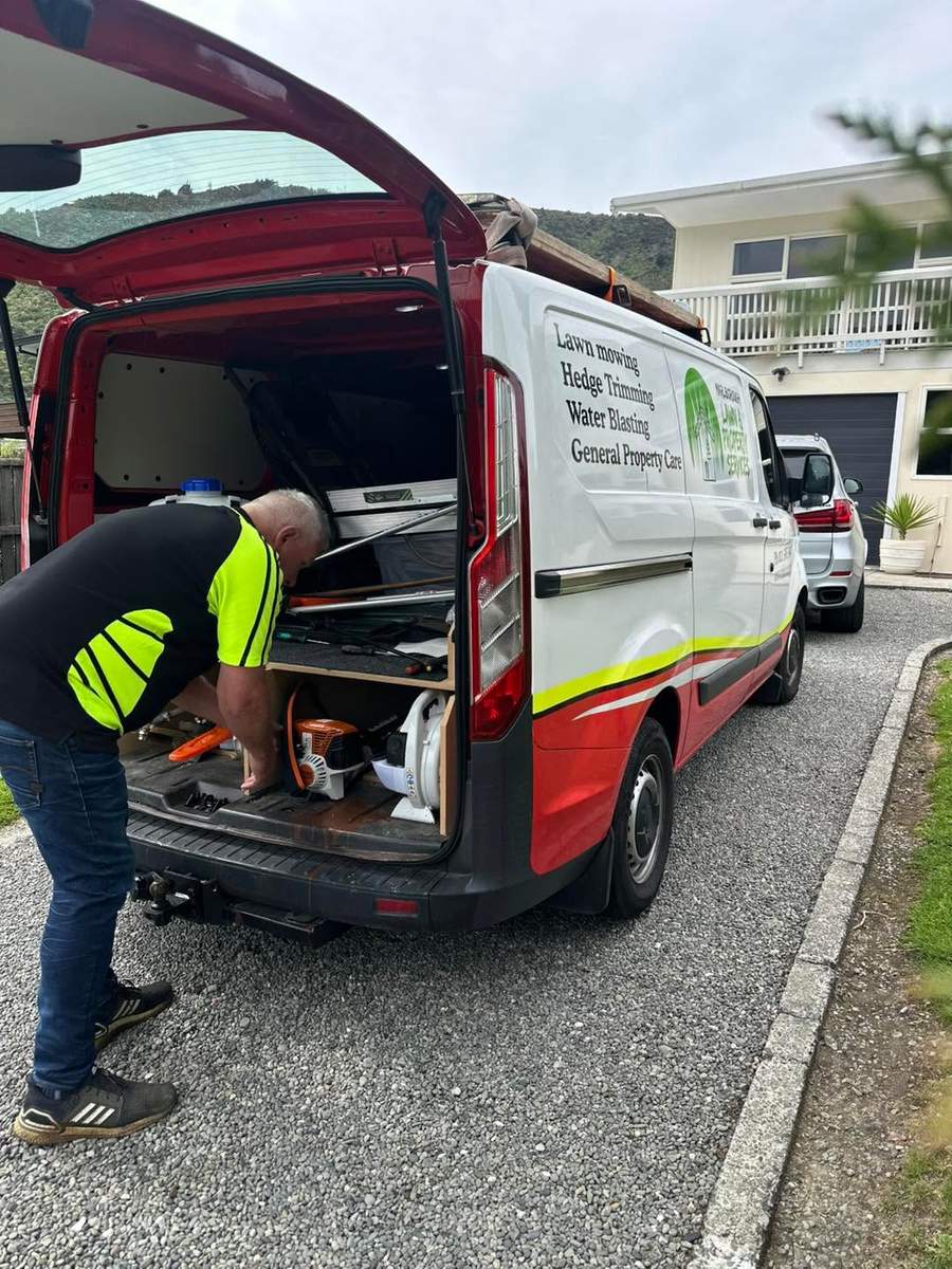 Van signage listing lawn mowing, hedge trimming, water blasting and property care